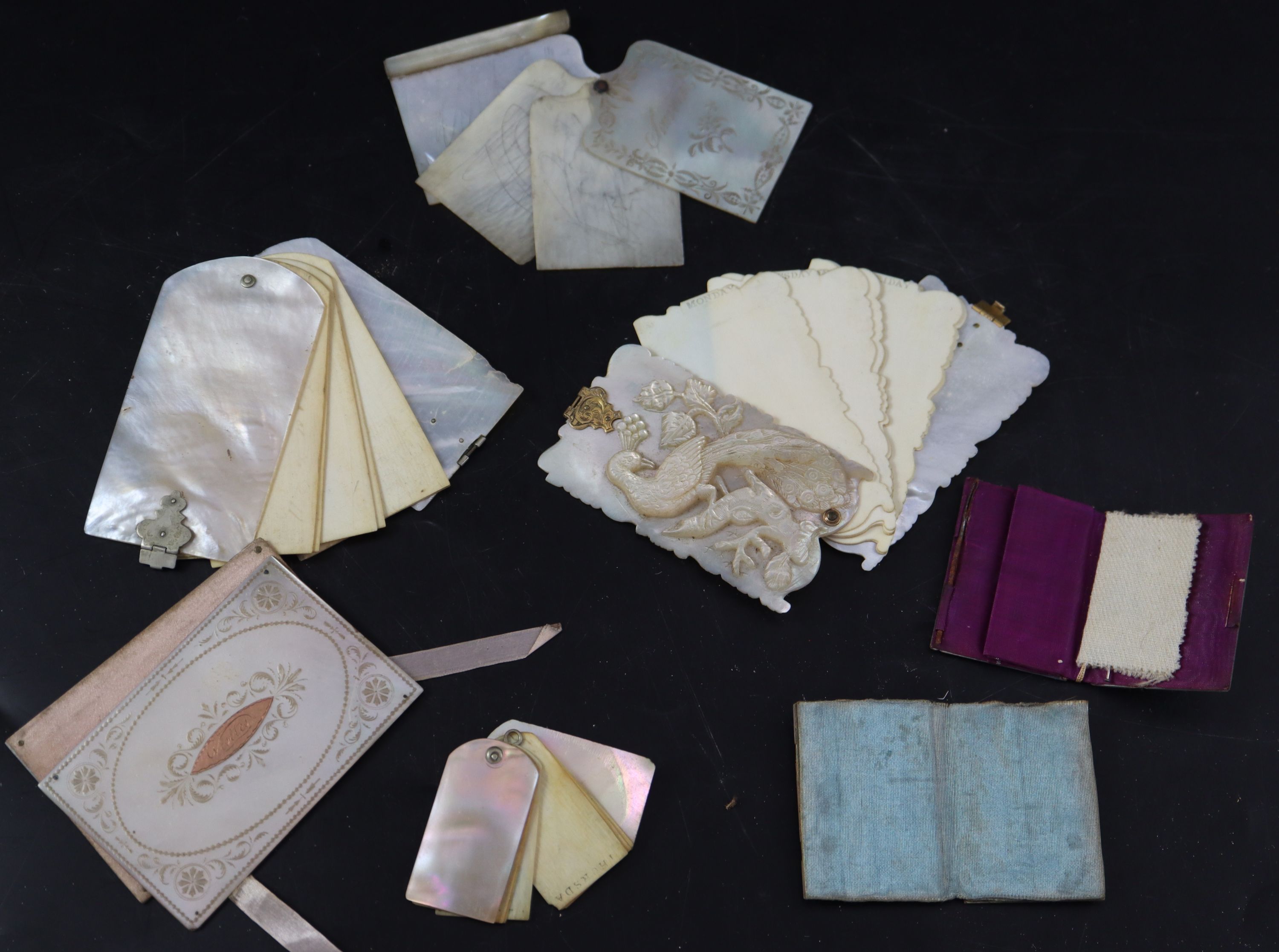 A collection of 19th century Palais Royale mother of pearl note cases and dance cards, largest 9cm (7)